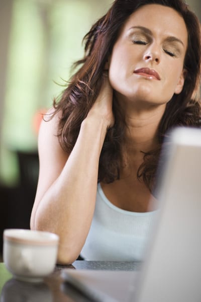 Tired woman in front of laptop computer